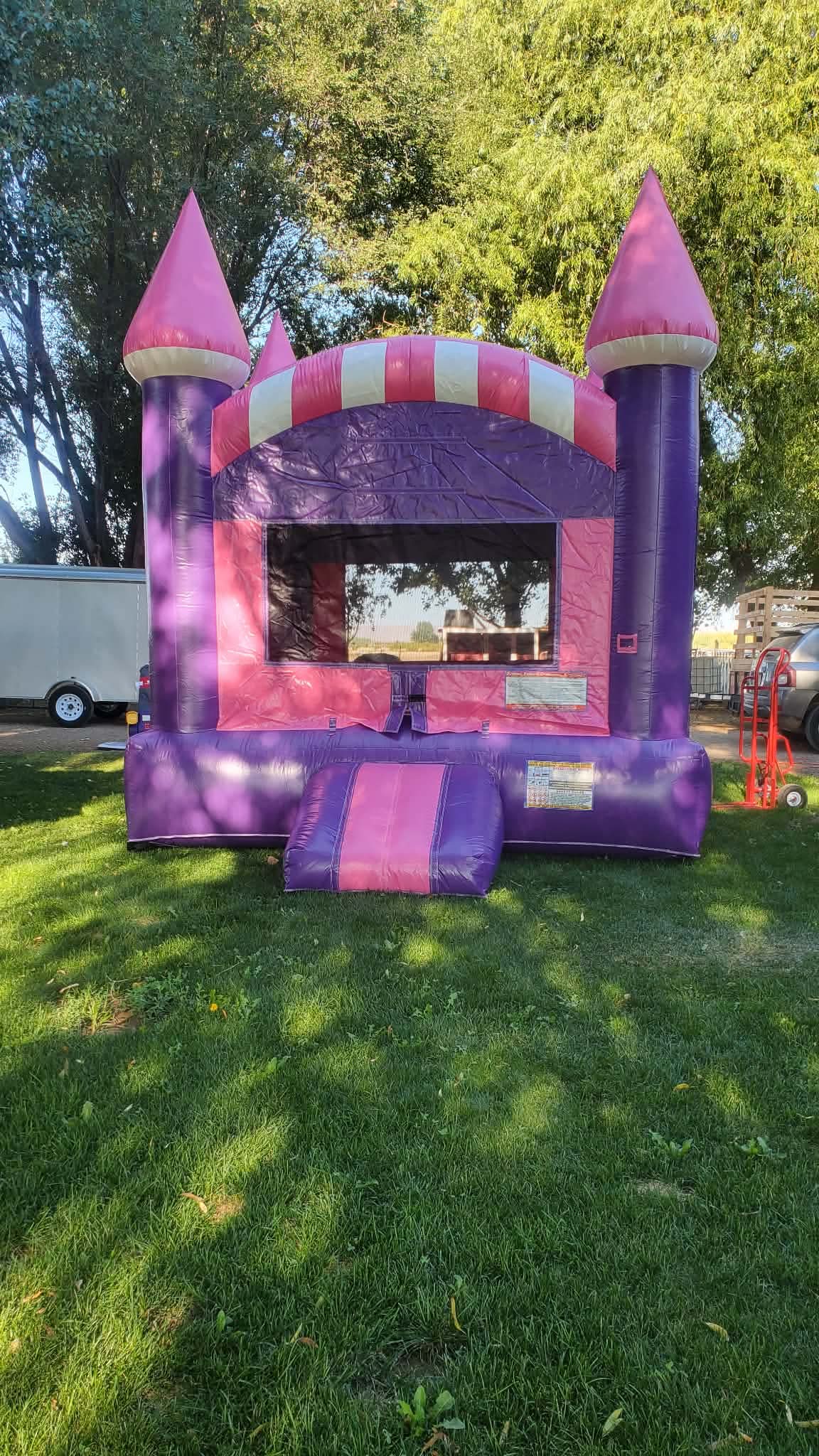 Pink and purple castle bounce house